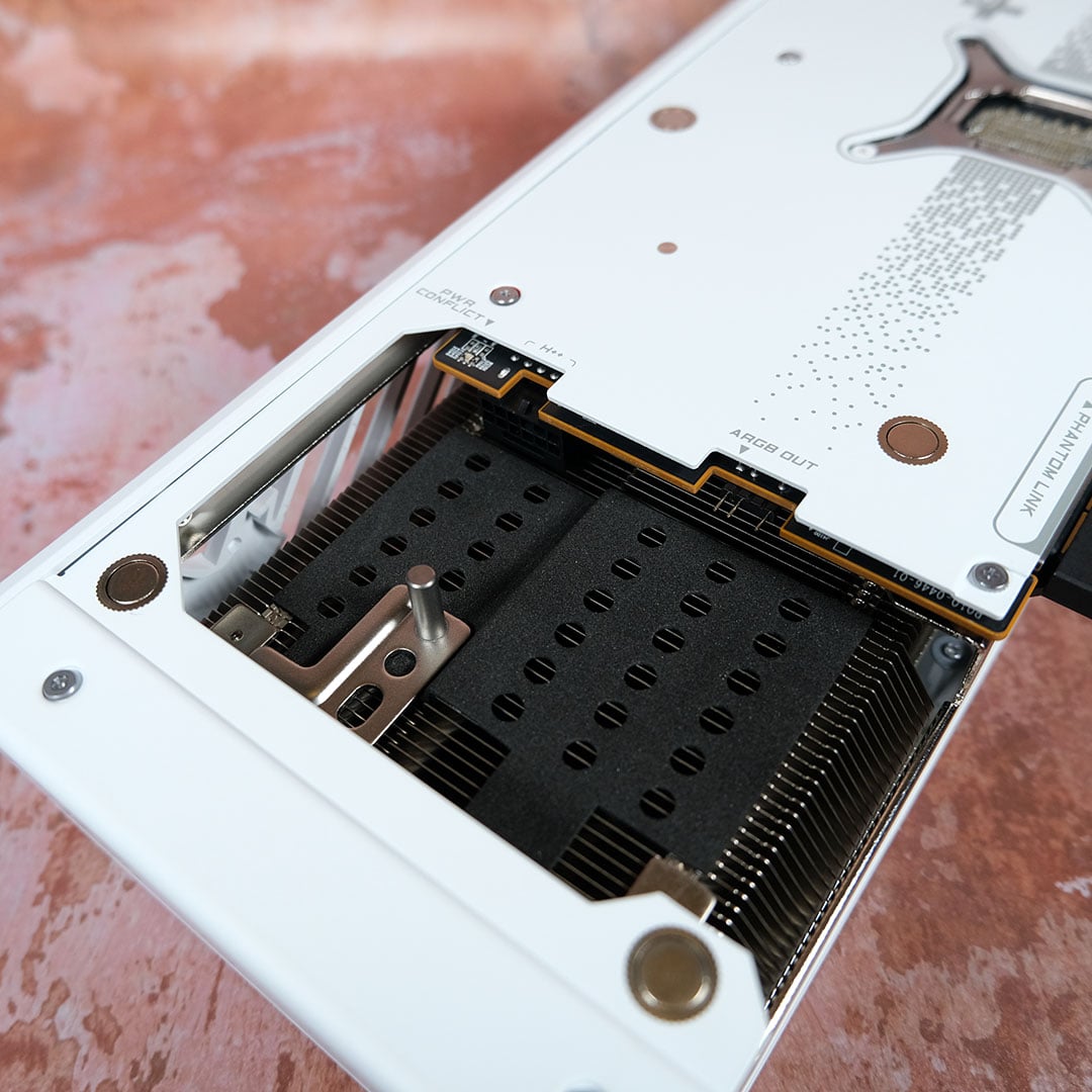 A top-down view of the compartment that houses the 16-pin and ARGB connectors on the Nitro+ Radeon RX 9070 XT PhantomLink Edition.