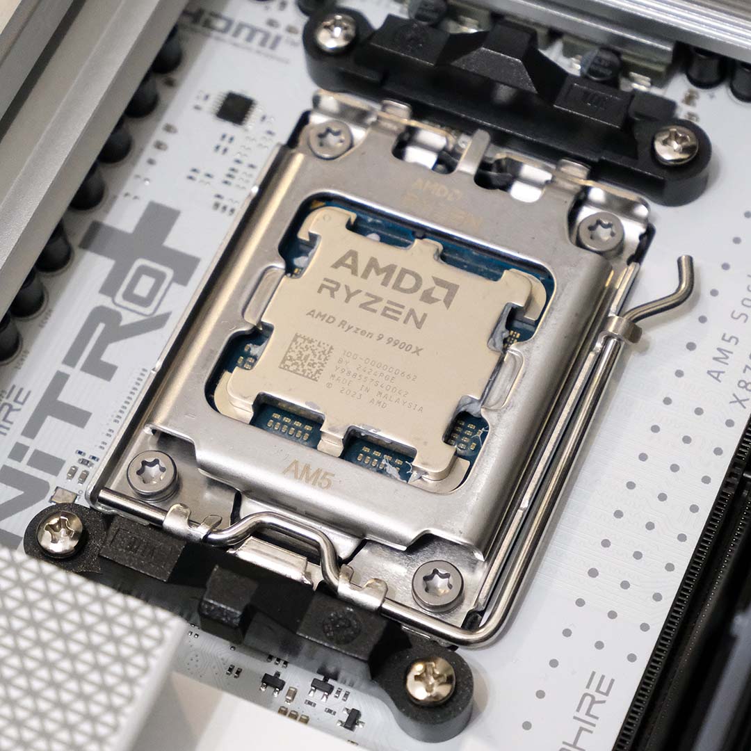 An AMD Ryzen 9 9900X processor inside the Nitro+ X870EA PhantomLink Polar Edition's AM5 CPU socket.