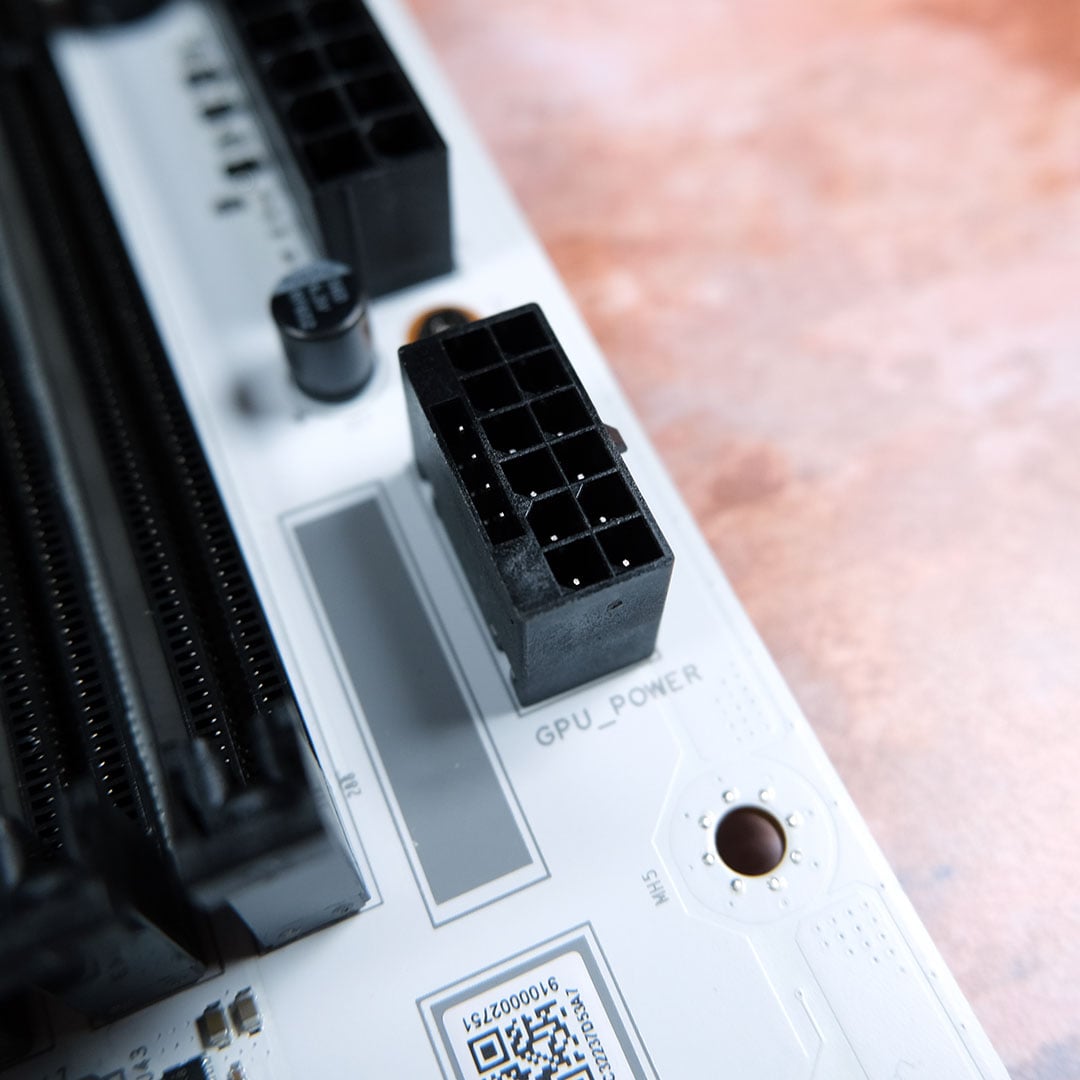 A close-up of the 12V-2x6 power connector on the Sapphire Nitro+ X870EA PhantomLink Polar Edition.