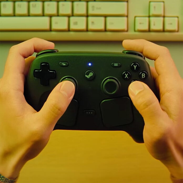 Two hands, holding a Steam Controller.