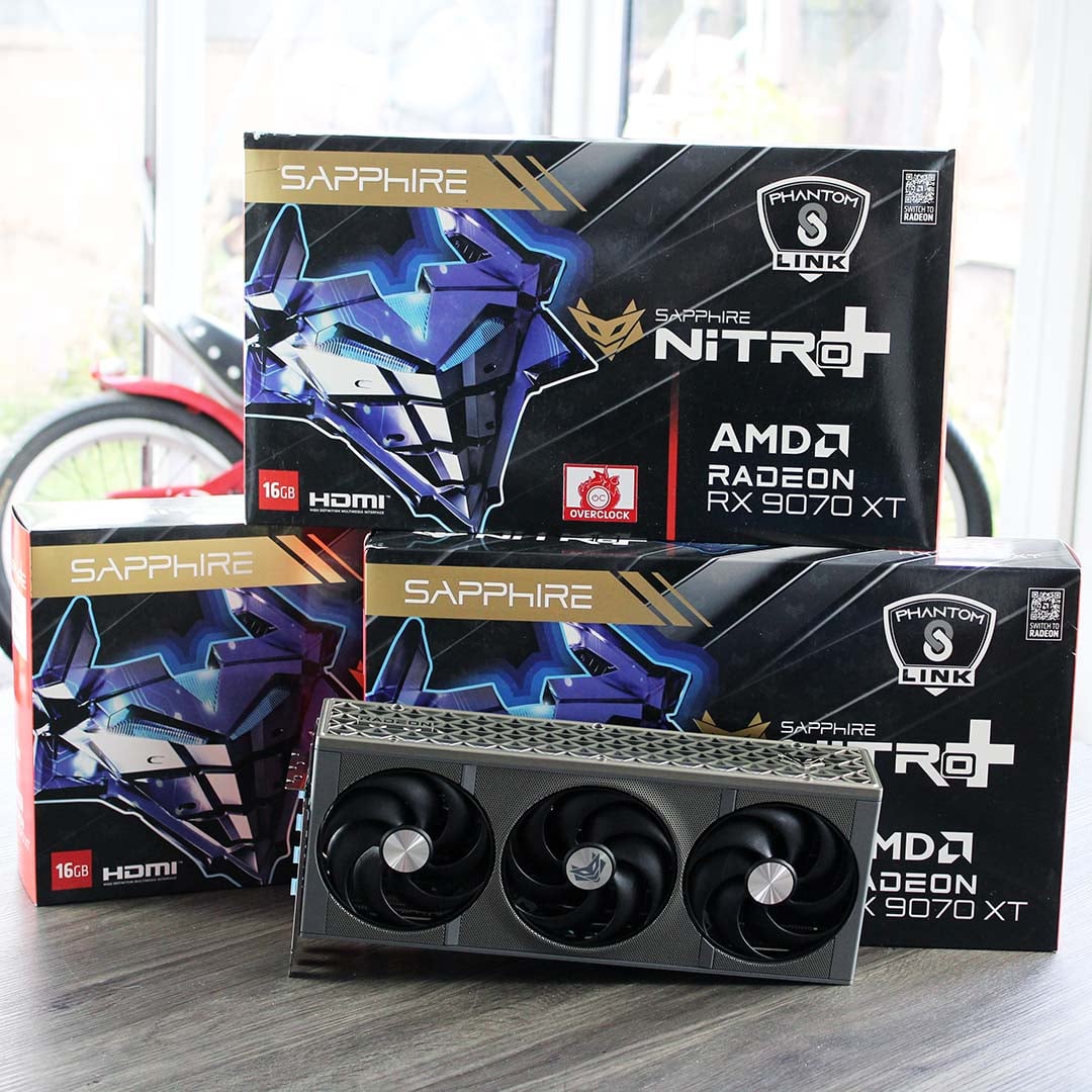 Three Sapphire AMD Radeon RX 9070 XT Nitro+ Phantom Link graphics cards with their boxes