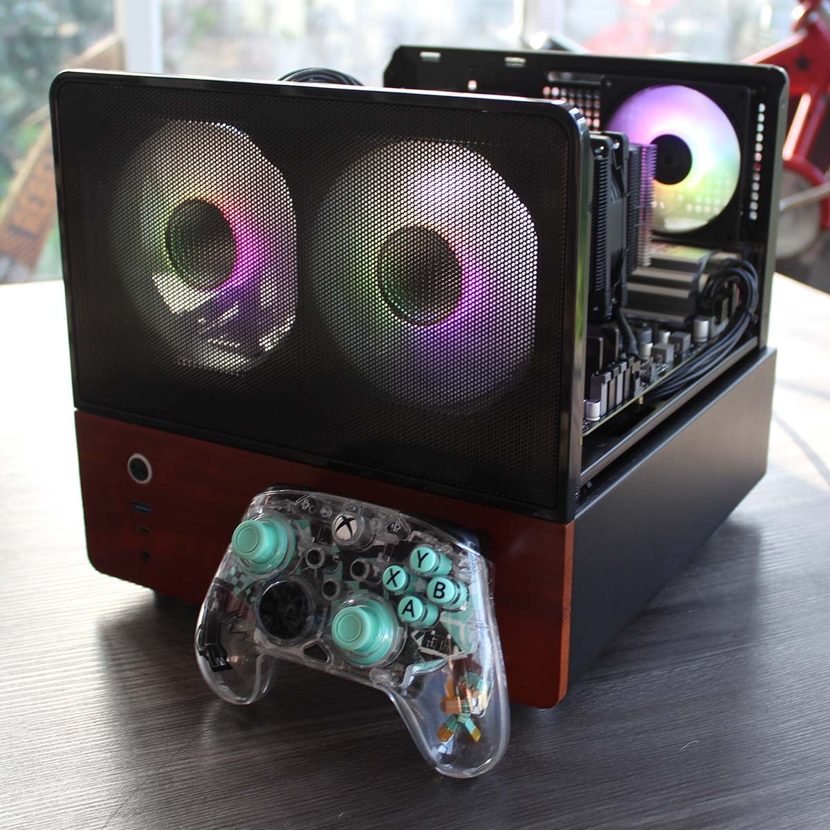 Wired2Fire Haven Ember Pro 9060 front 3/4 shot with glass removed and gamepad for scale