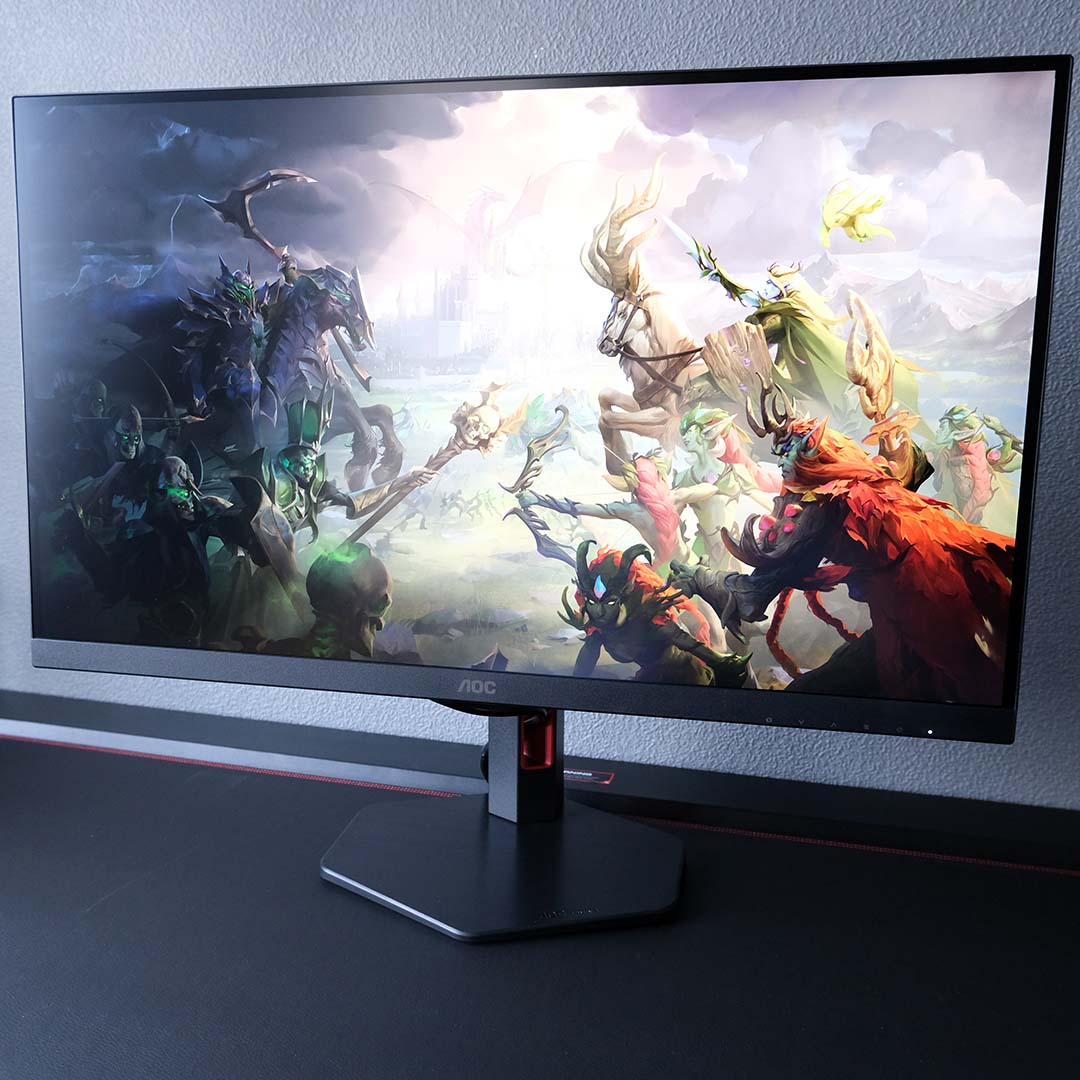 The AOC Q27G4ZR displaying Heroes of Might & Magic: Olden Era key art.