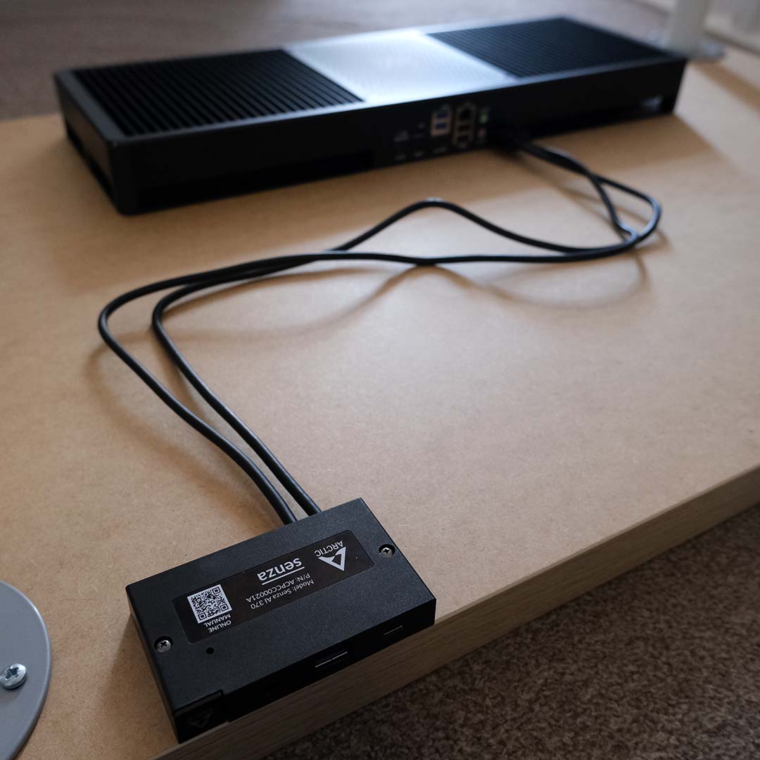 An Arctic Senza and front panel attached to a desk.