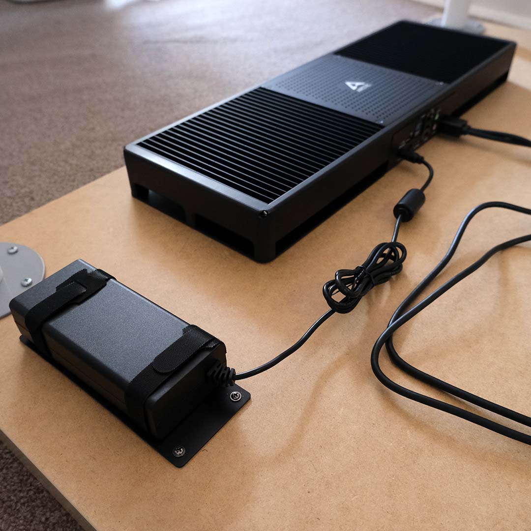 An Arctic Senza and power supply attached to a desk.
