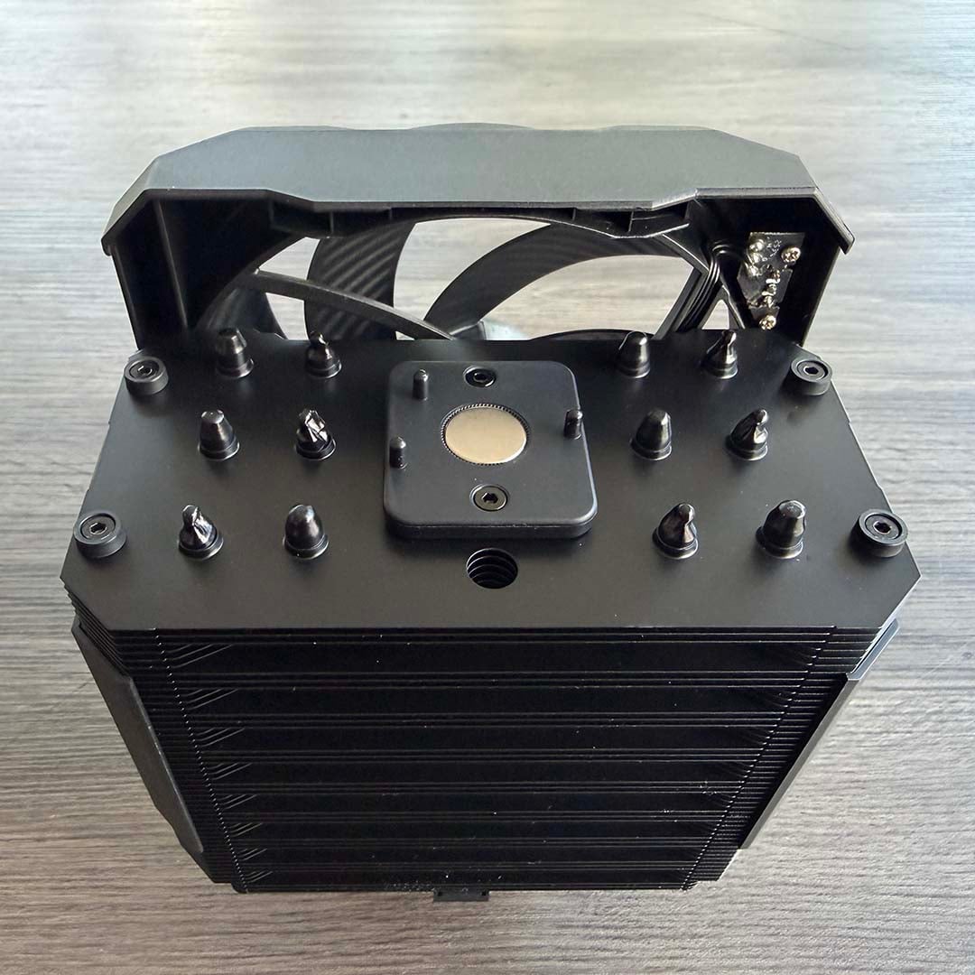 be quiet! Dark Rock 6 with front fan raised, showing magnet and heatpipe ends