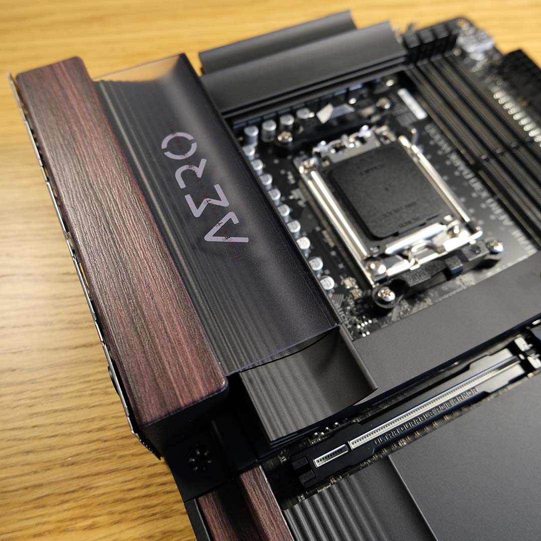 A close-up of the Gigabyte X870E X3D Dark Wood, focussing on the wooden accents atop its VRM.