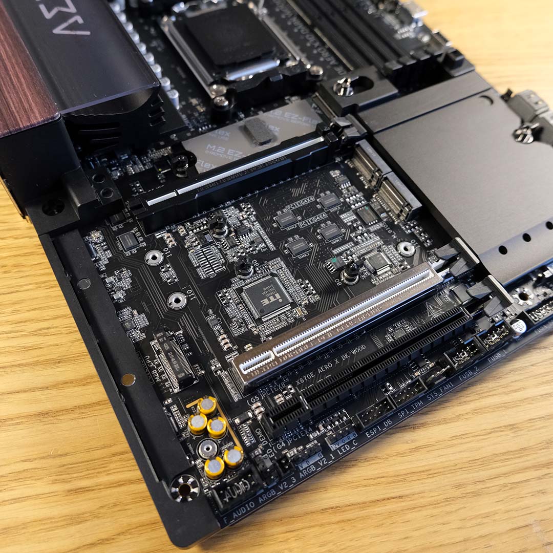 The expansion slots and M.2 slots on the Gigabyte X870E X3D Dark Wood motherboard.