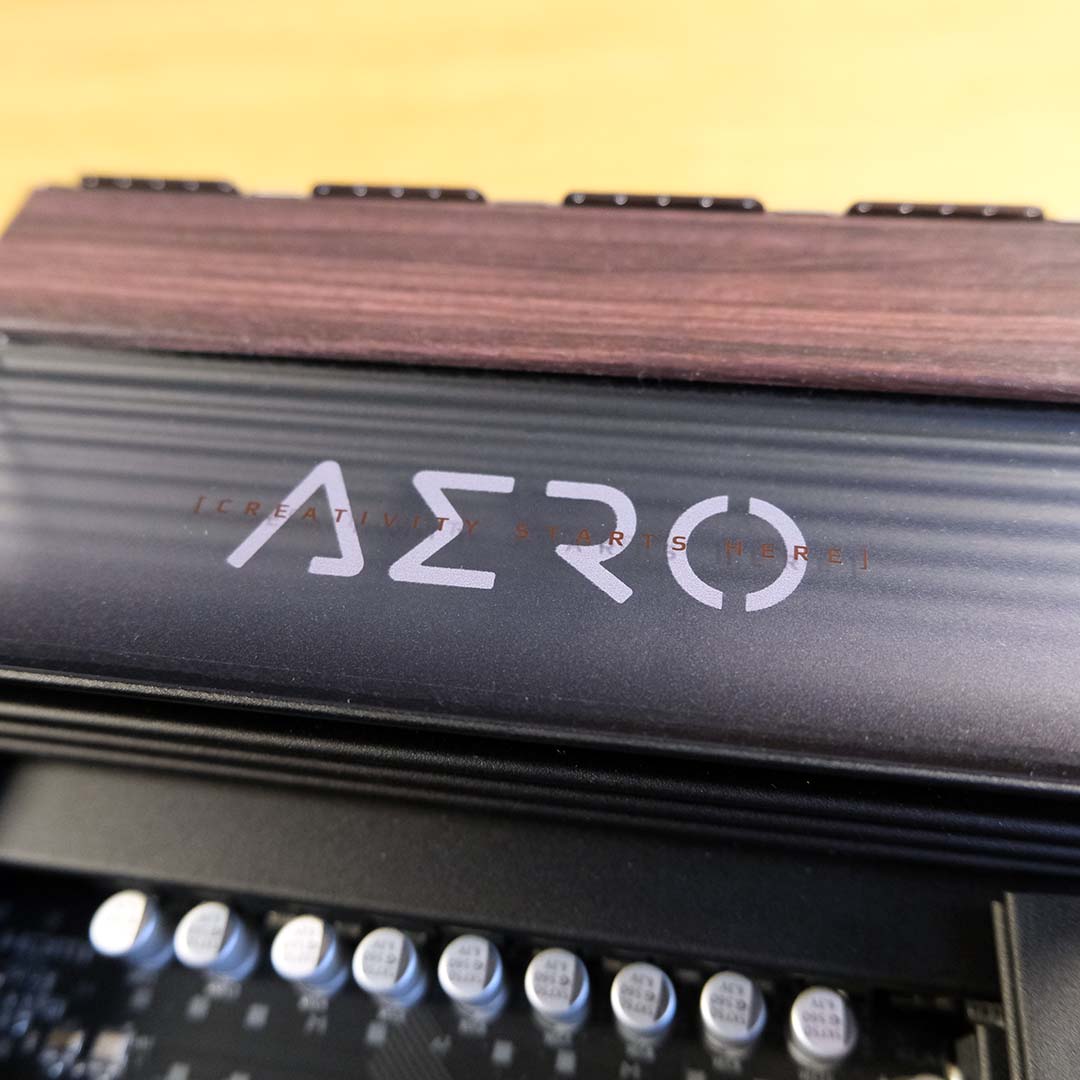 The 'Aero' logo on the Gigabyte X870E X3D Dark Wood.