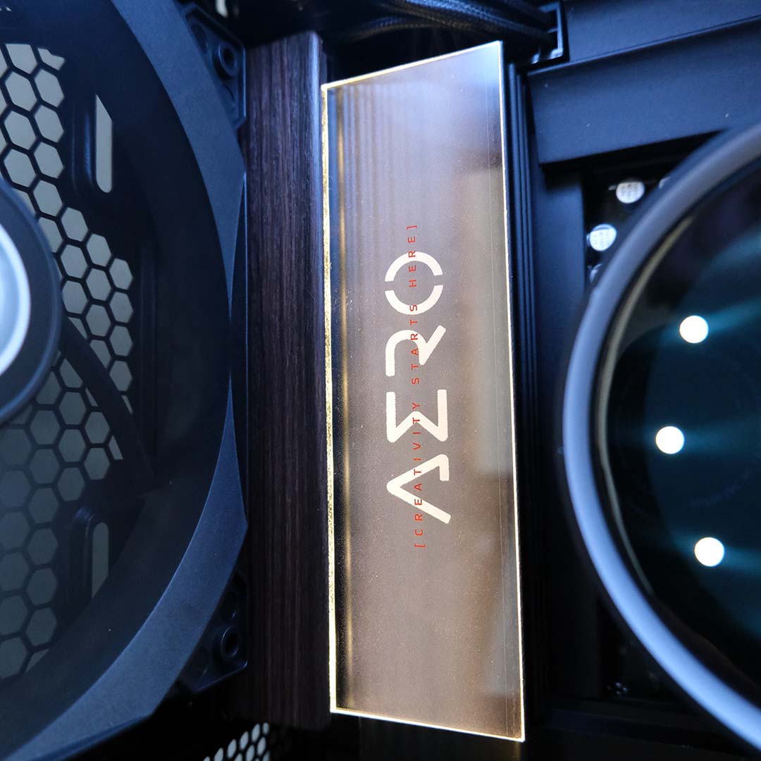 A close-up of the 'Aero' LED on the Gigabyte X870E Aero X3D Dark Wood motherboard.