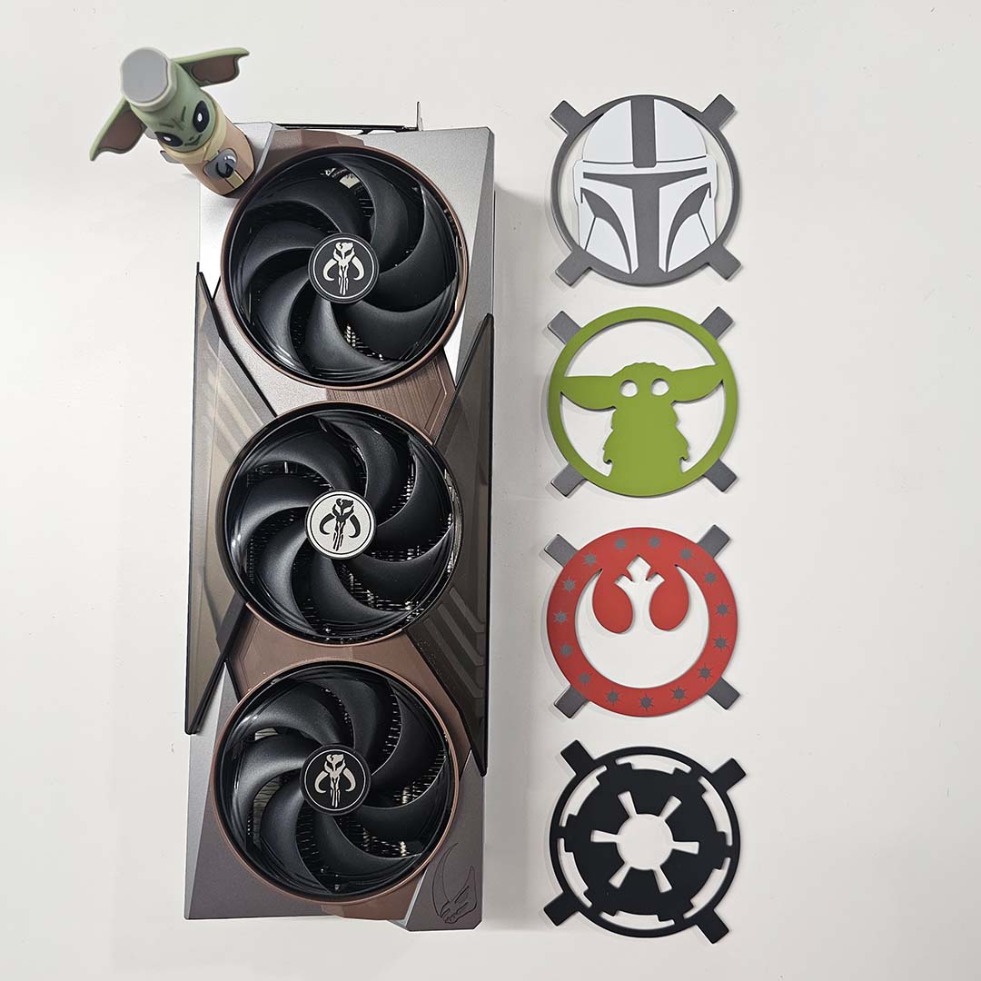 Top-down view of the MSI GeForce RTX 5080 16GB The Mandolorian and Grogu Edition OC graphics card (left), alongside its magnetic backplates (right) and VGA stand (top left).