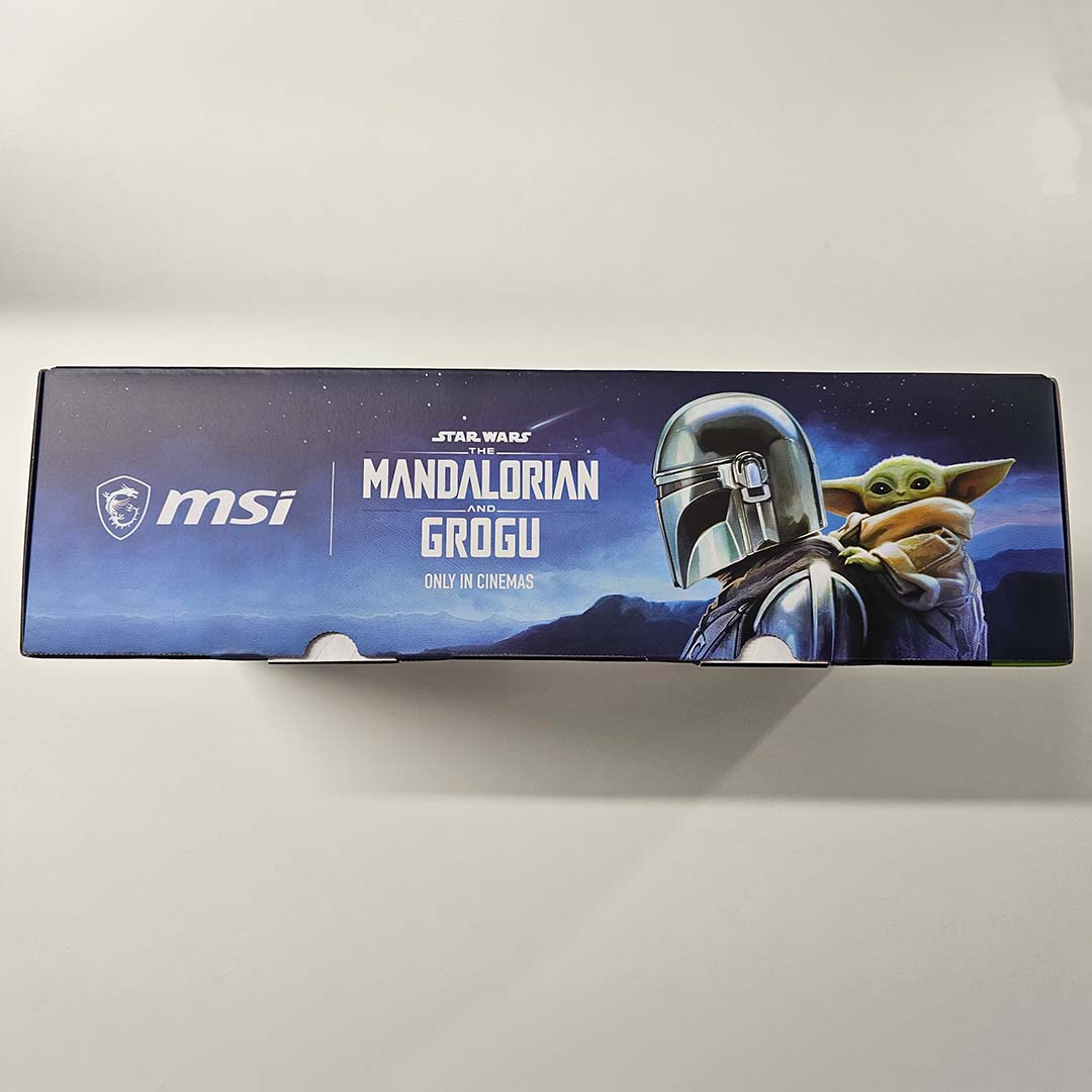 A top-down view of the MSI GeForce RTX 5080 16GB The Mandolorian and Grogu Edition OC's pacakging, featuring motifs of its titular characters.