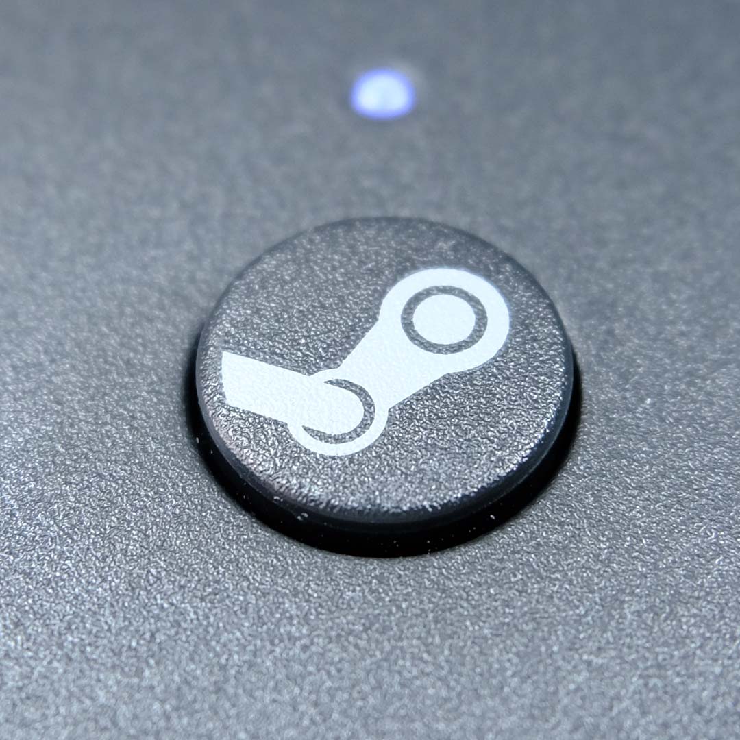 A close-up of a Steam logo on the Steam Controller.