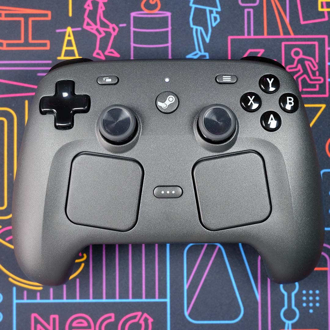 A Steam Controller, atop a neon backdrop.