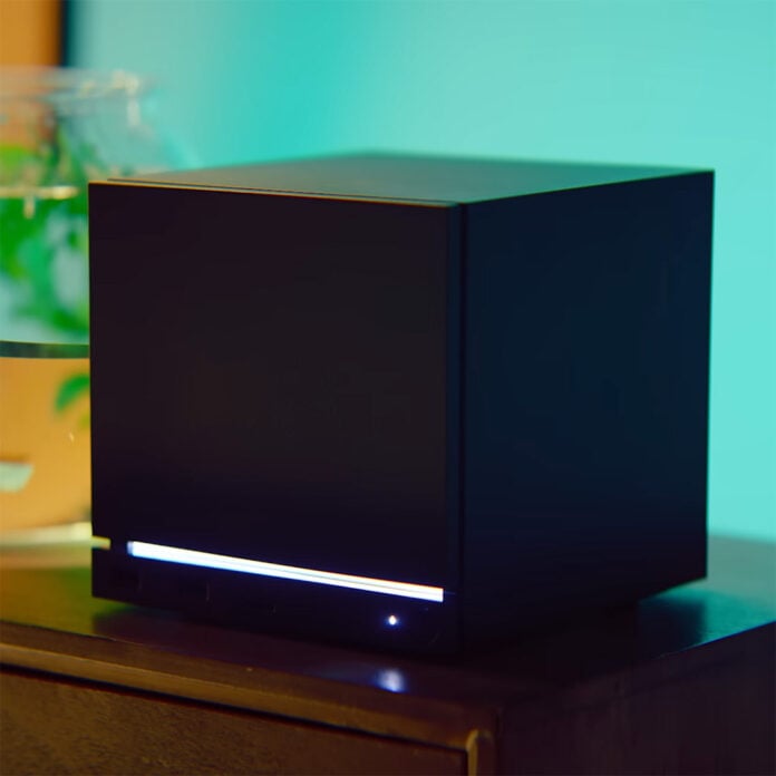 A Steam Machine, atop a wooden surface.