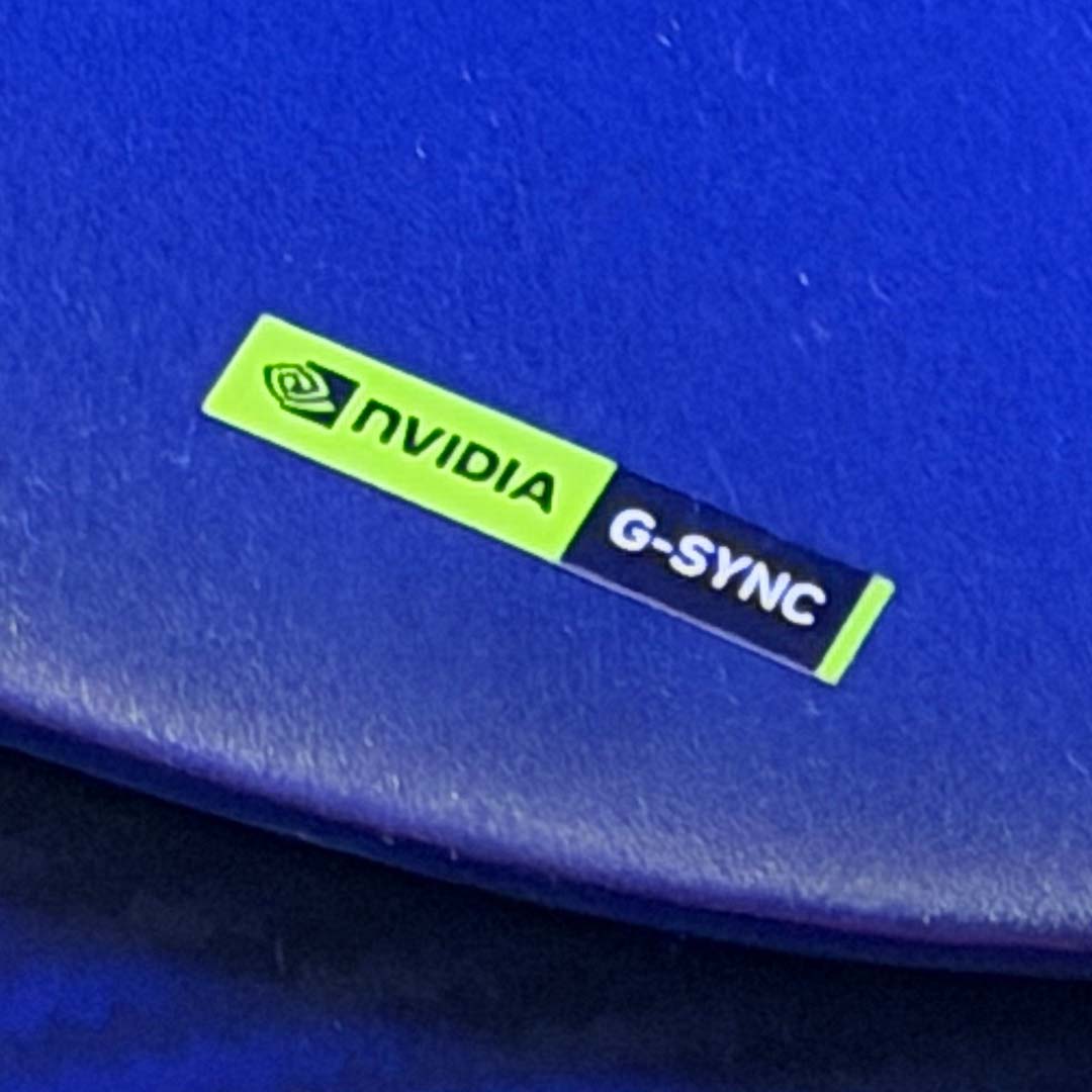 A close-up of the Nvidia G-Sync logo on the Alienware AW3426DW's base.