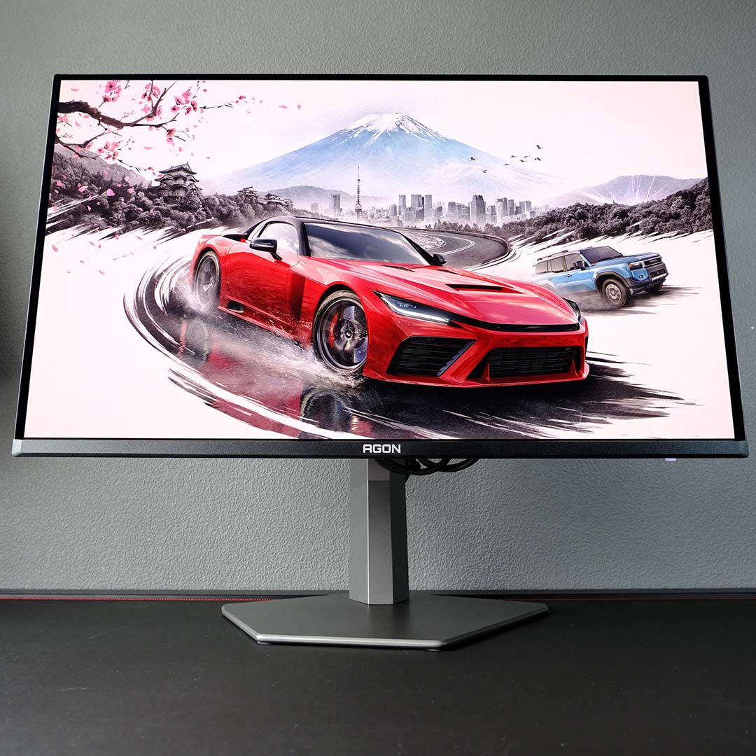 An AOC Agon Pro AG326UZD2 monitor, displaying Forza Horizon 6 artwork.
