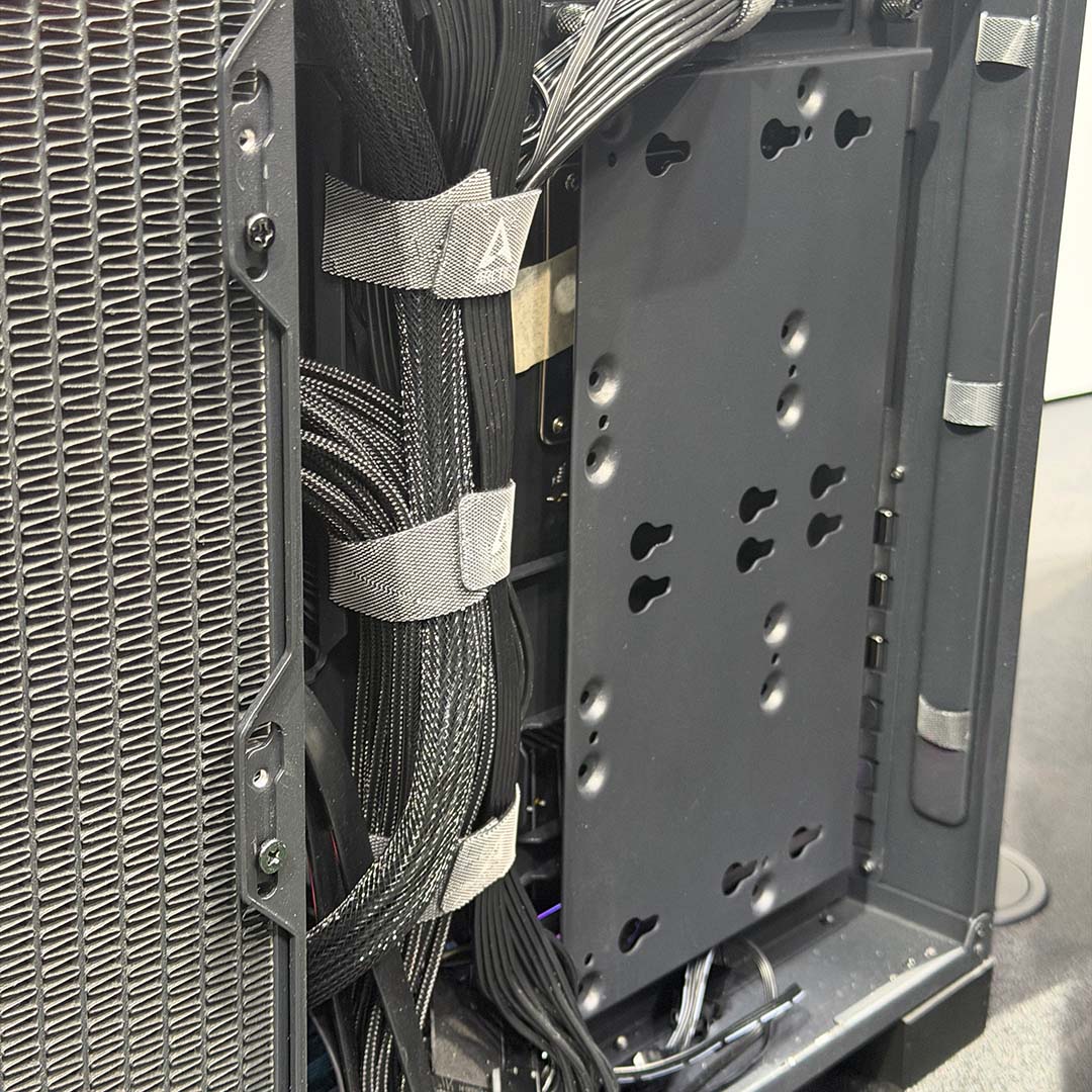 A close-up of cable management and drive bays in the Arctic Xtender Mini.