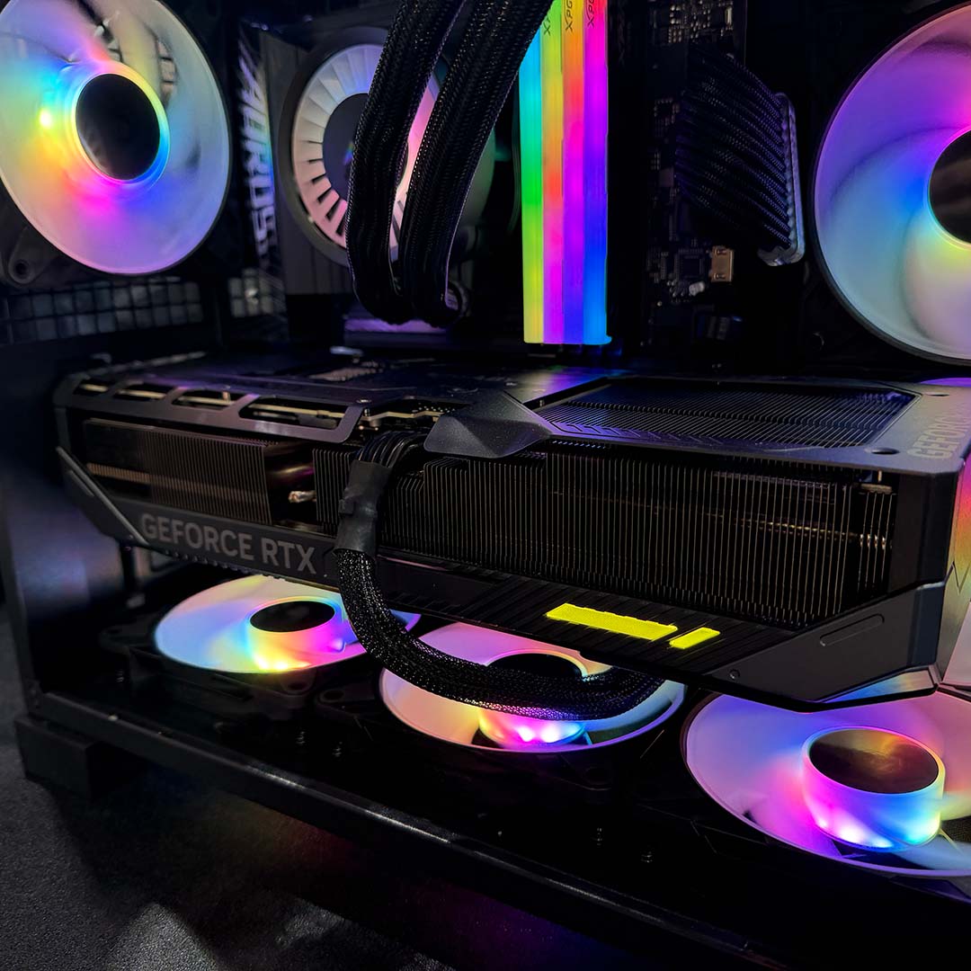 A close-up of a large GeForce RTX graphics card in the Arctic Xtender Mini.