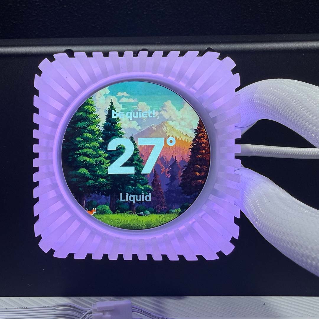 A close-up of the be quiet! Light Loop IO LCD's pump unit, in white, showcasing its IPS LCD display, with purple LEDs.