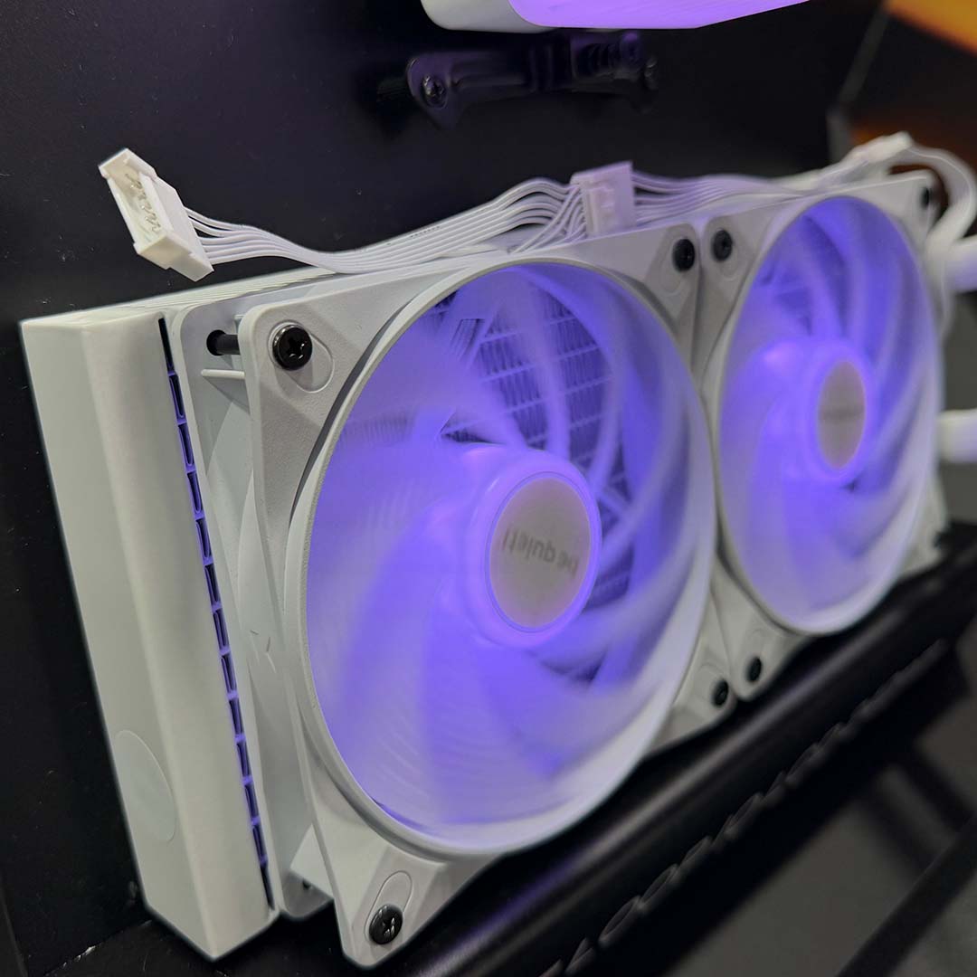 A side-on view of the be quiet! Light Loop IO LCD 240's fans, in white, with purple LCDs.