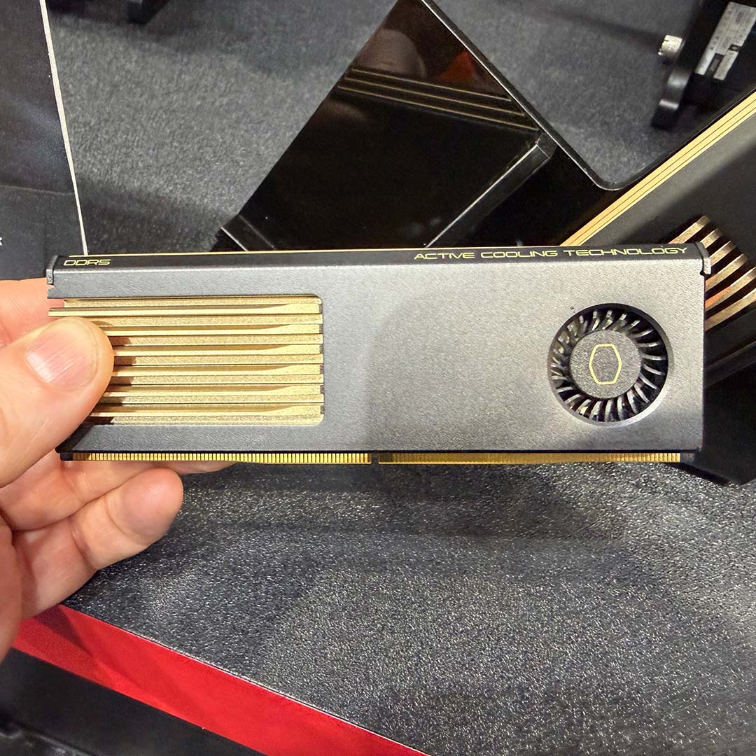A G.Skill AMD ULL-EXPO RAM stick, held in a hand.