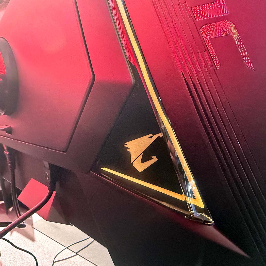 A close-up of a glowing Aorus logo on the back of hte Gigabyte Aorus Elite 5K Mini LED.