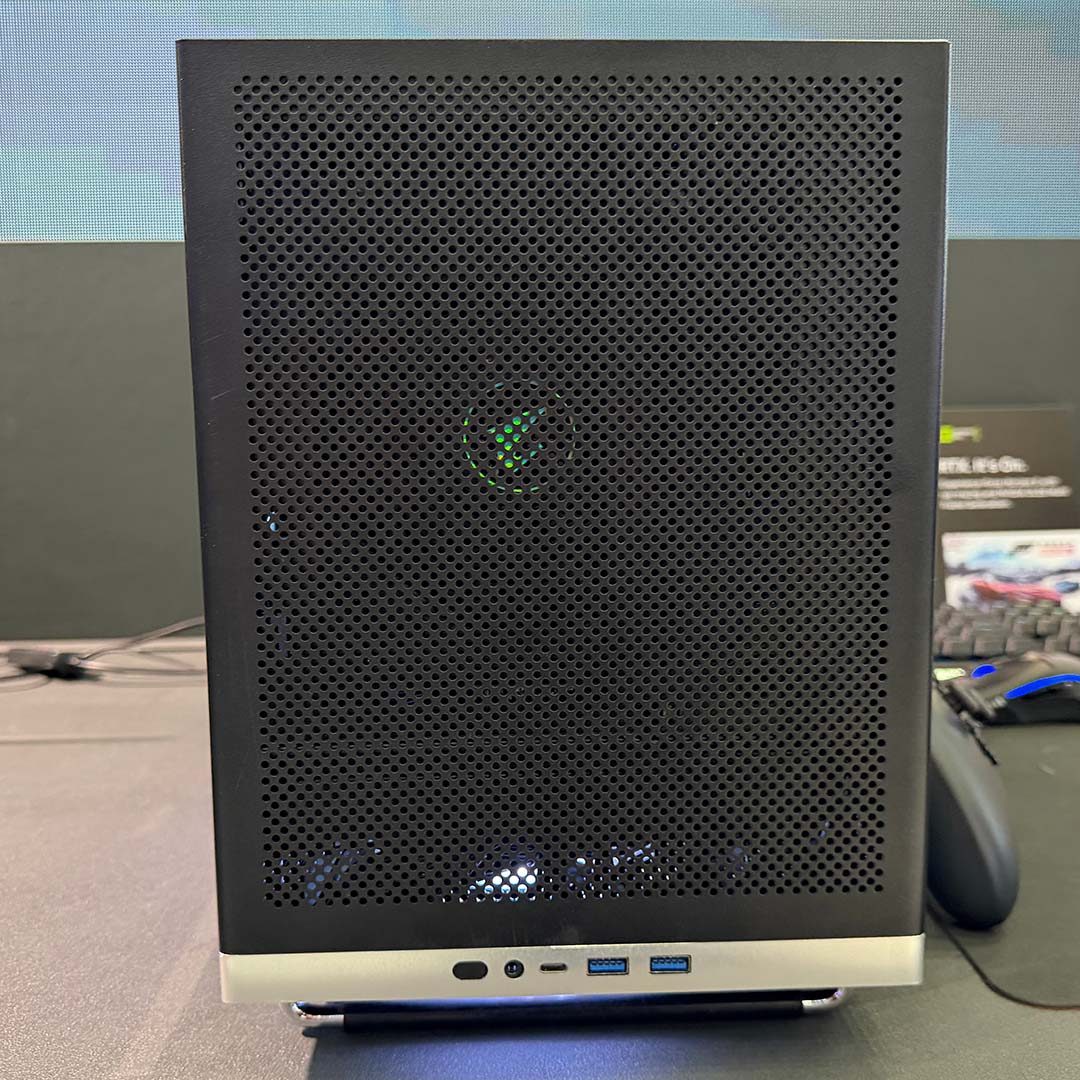 A head-on view of the Aorus C510 Glass Infinity, from which an Aorus logo is visible through the front ventilation cutouts.