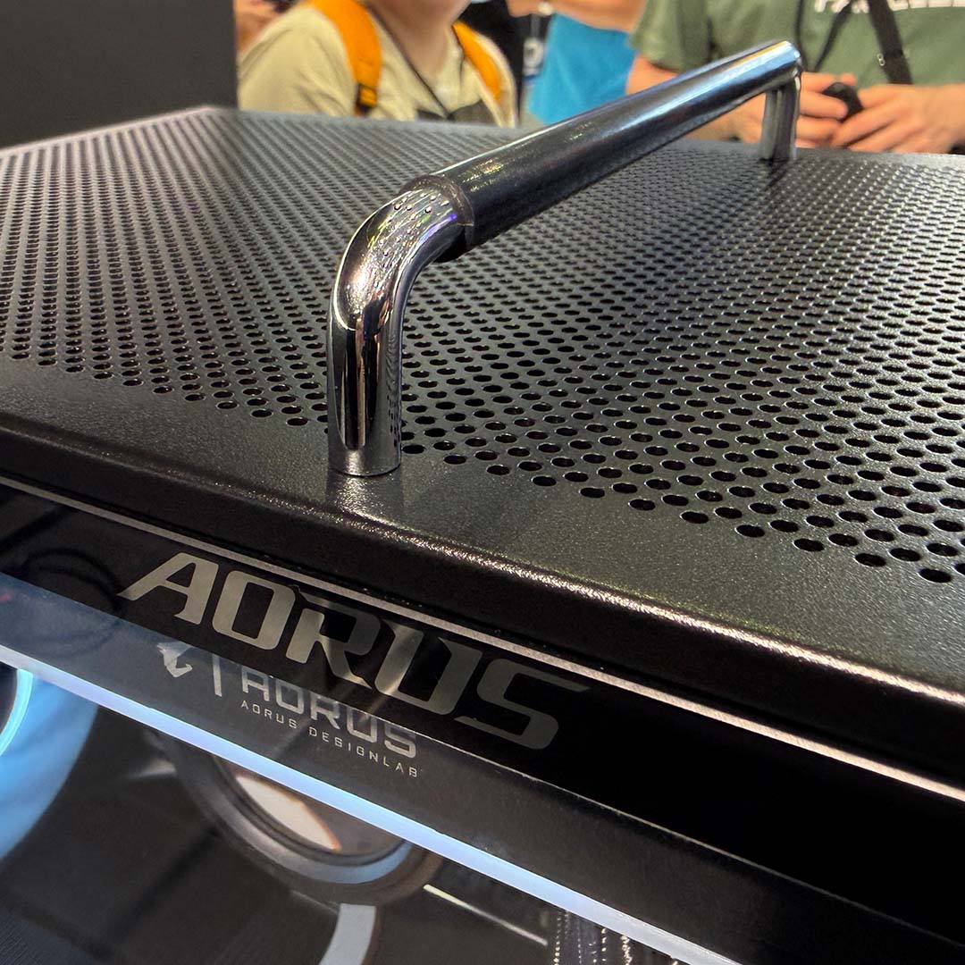 A side-on view of the The Aorus C510 Glass Infinity, showcasing its carry handle.