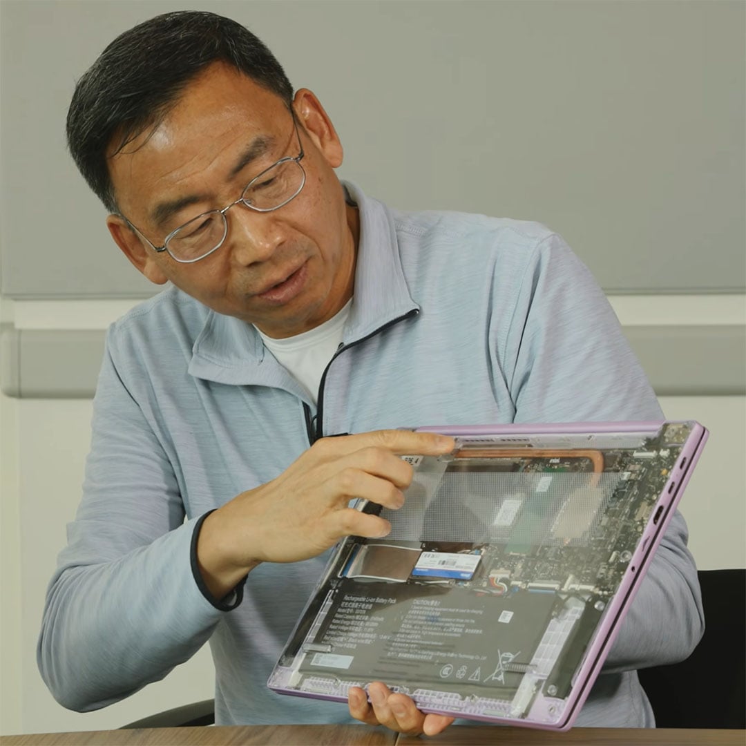 An Intel employee holding a Firefly concept laptop design.