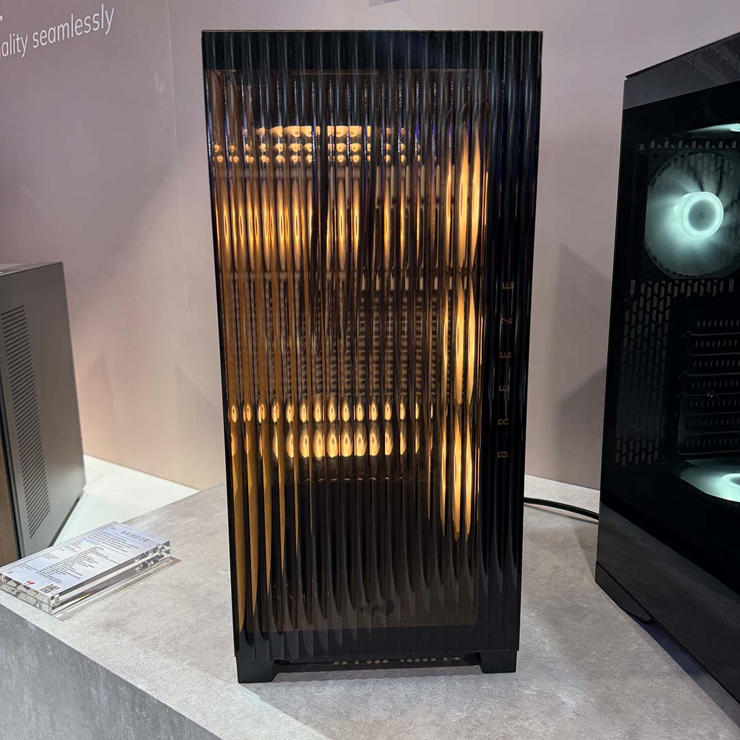 An InWin Breeze case, black in colour with amber RGB LED fans.