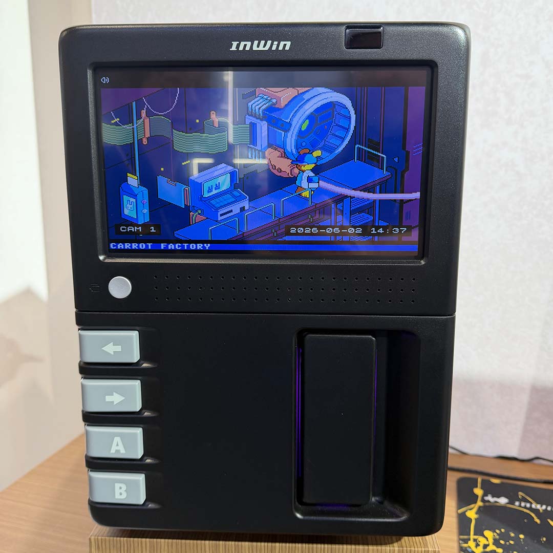 The front of the InWin GX-285 PC case, running one its arcade-style games on its LCD panel.