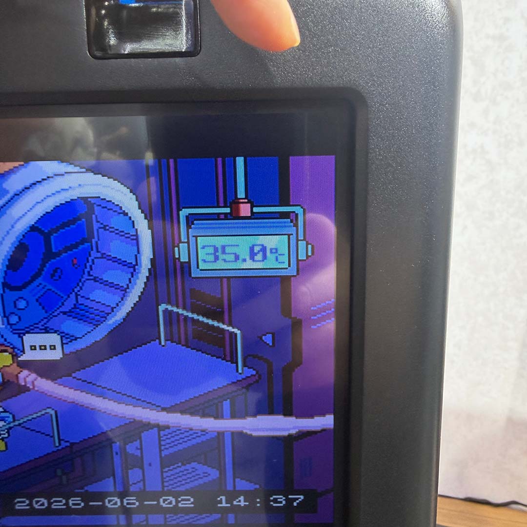 A close-up of the InWin GX 285's LCD, showcasing how system information integrates into the case's built-in games.