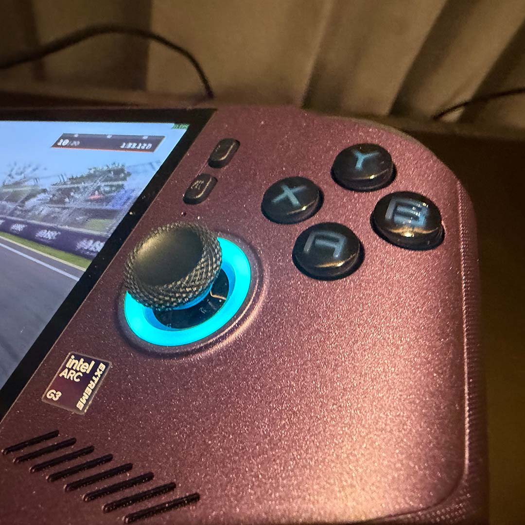 A close-up of the right thumbstick and face buttons on the MSI Claw 8 EX AI+.