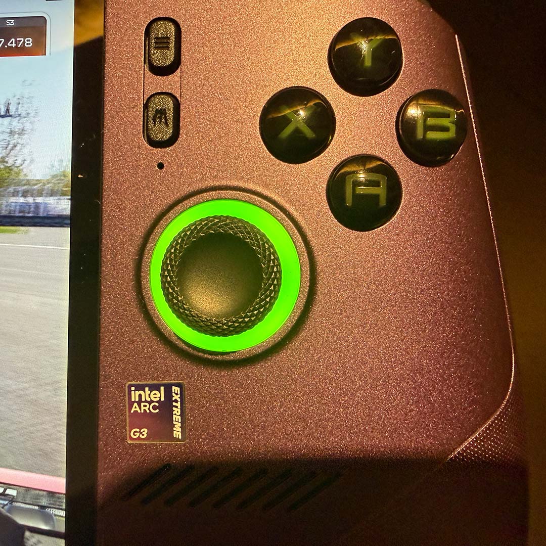 A close-up of the right thumbstick and face buttons on the MSI Claw 8 EX AI+.