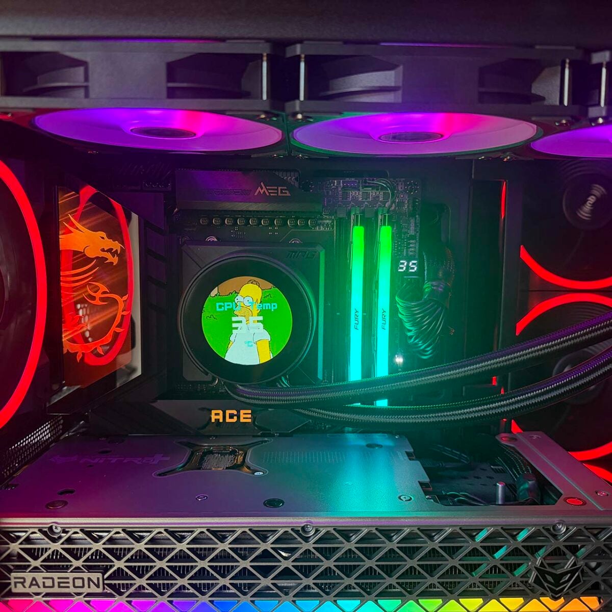 MSI MPG CoreLiquid P22 360 LCD showing Homer Simpson meme and CPU temp with RGB fans