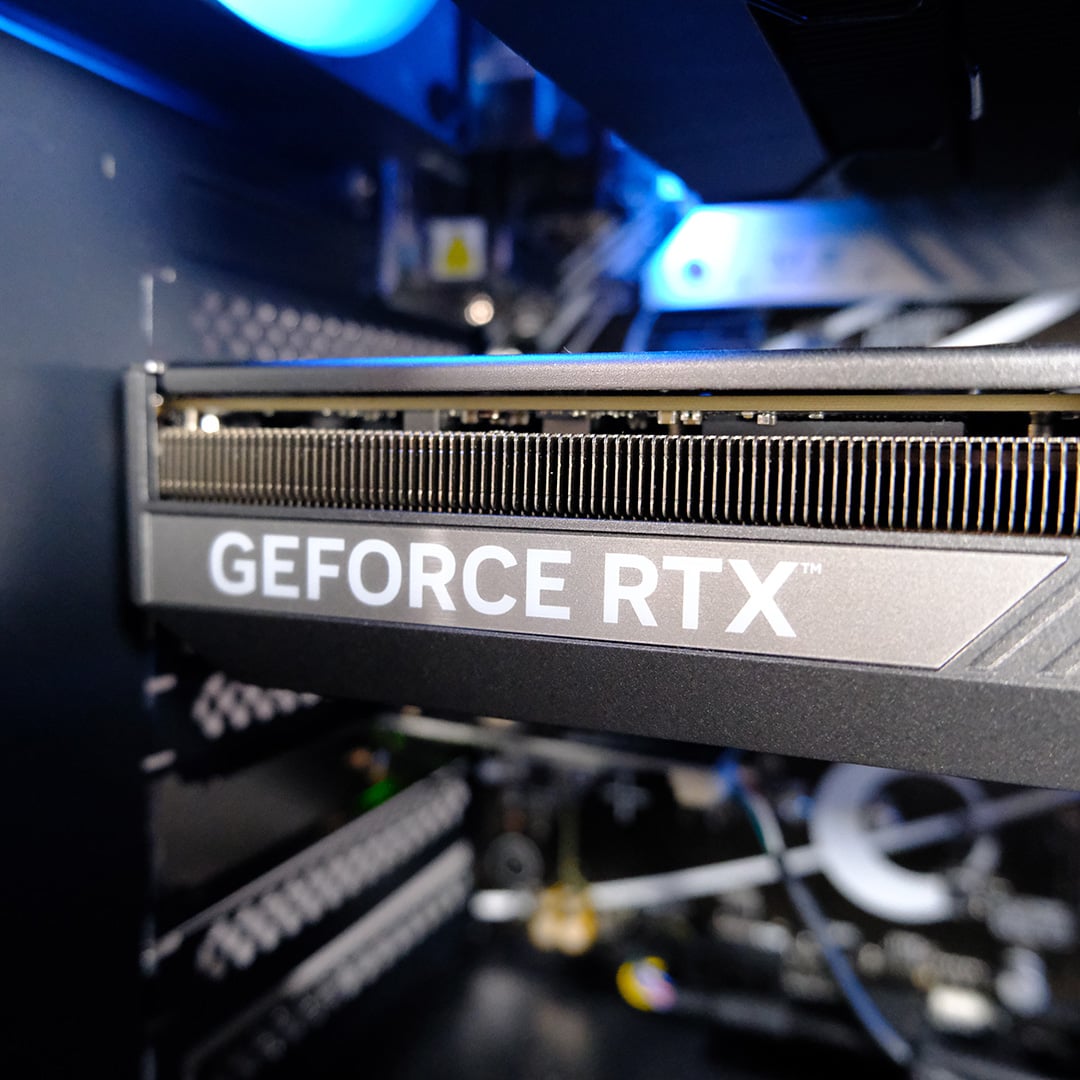 A close-up of the 'GeForce RTX' logo on the graphics card inside the PCSpecialist Elite Storm II.