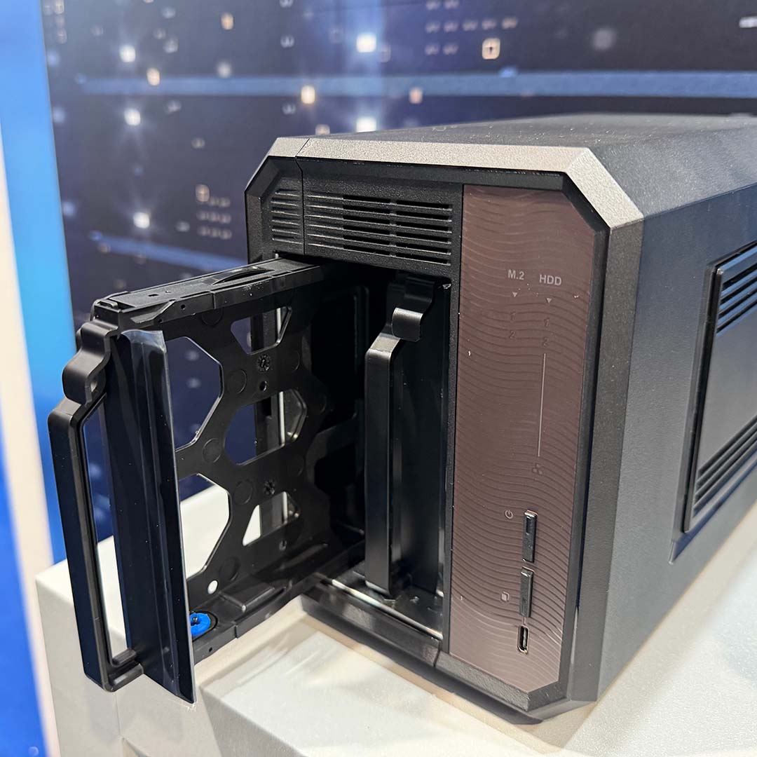 The QNAP TS-h265 with drive bays exposed.