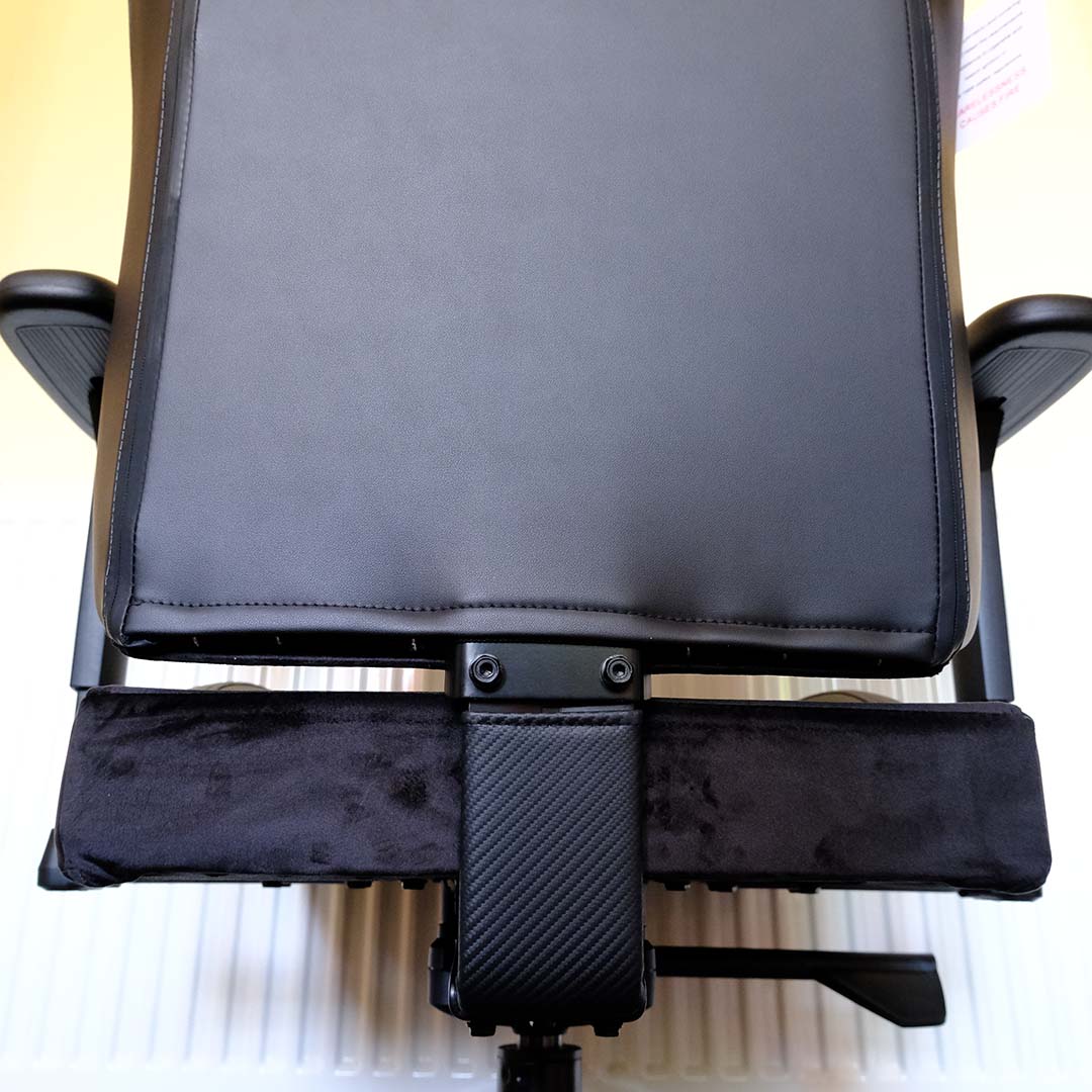 A bottom-up view of the ThunderX3 Solo 360 gaming chair, focussing on the gap between the backrest and seat cushion,