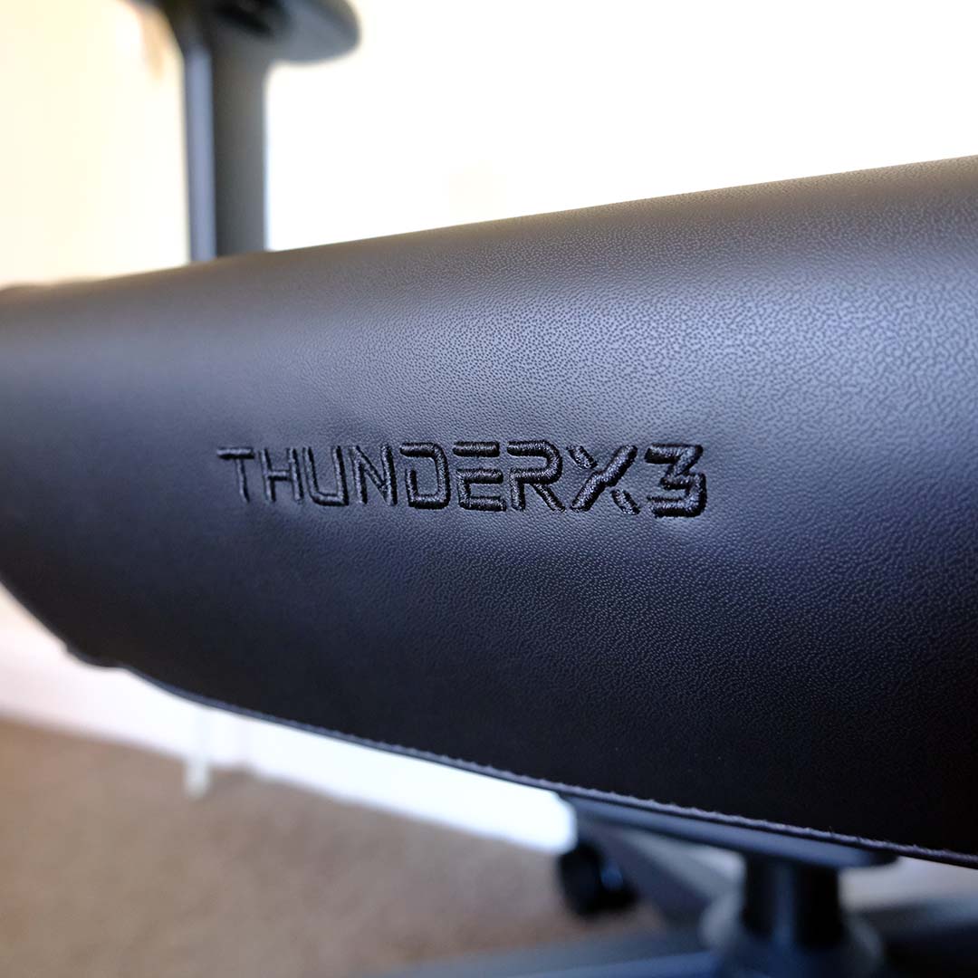 A close-up of the ThunderX3 logo on the Solo 360's seat cushion