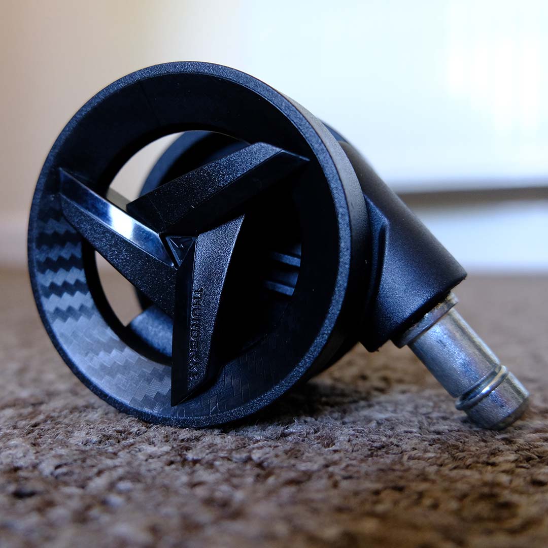 A close-up of the wheels for the Thunder X3 Solo 360 gaming chair.
