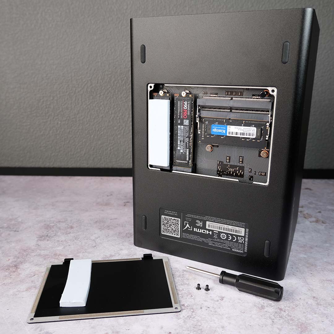 The underside of the Ugreen NASync DXP4800 GT, its panel removed, exposing its M.2 and SODIMM slots.