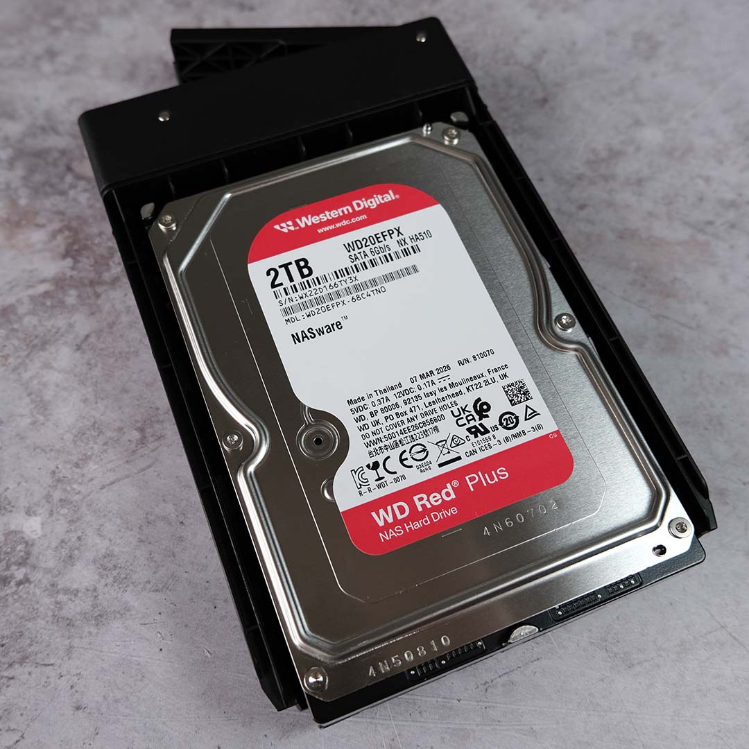 A HDD installed in the bay of a Ugreen NASync DXP4800 GT.