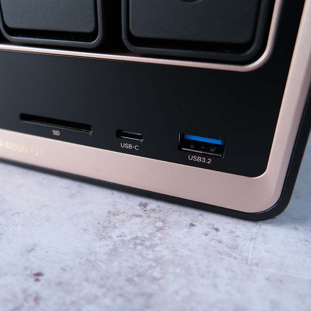 A close-up of the front USB and SD card ports on the Ugreen NASync DXP4800 GT.