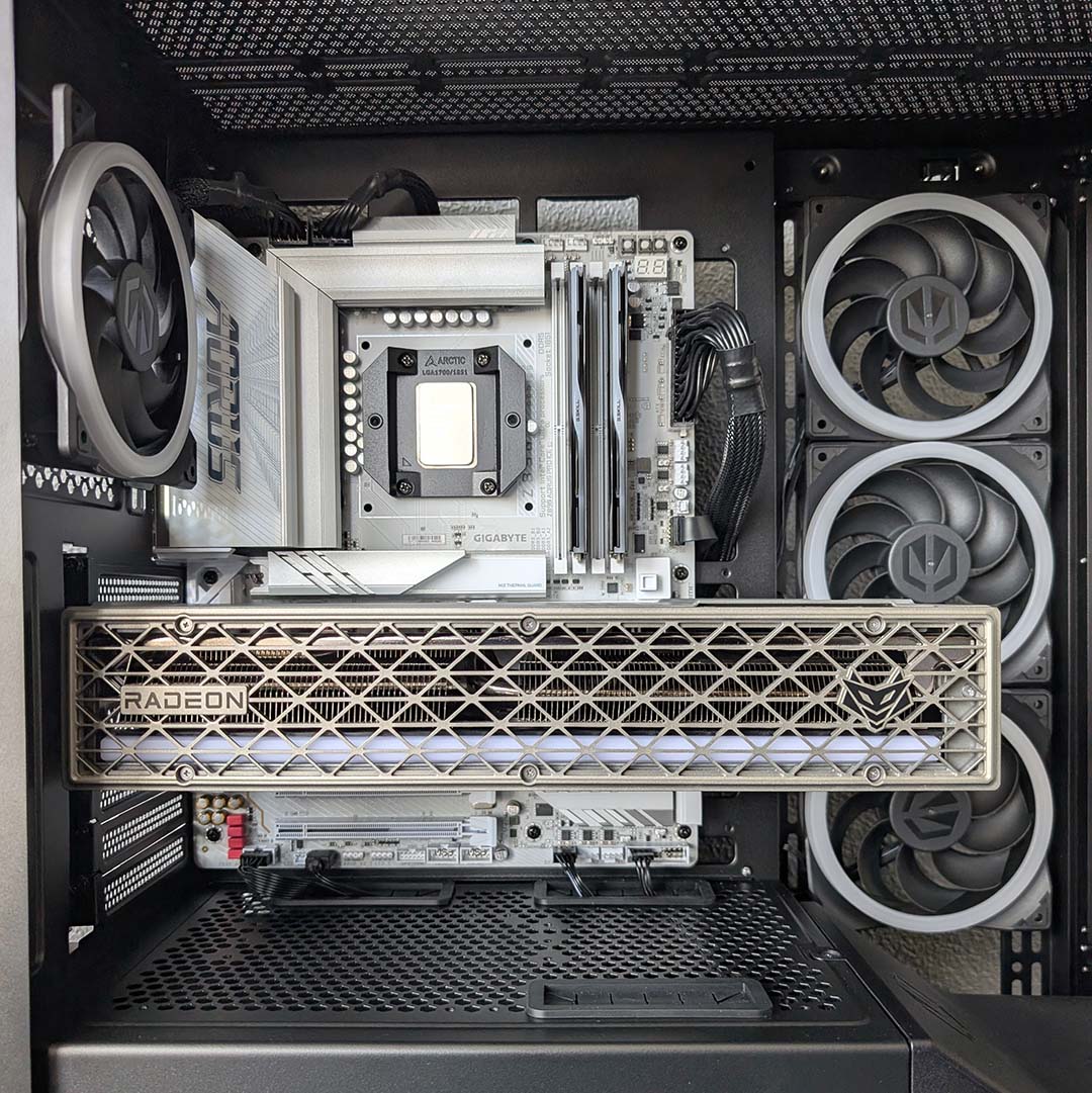 A graphics card and cables, installed into a motherboard, inside the Fishtank 6000 Corona.