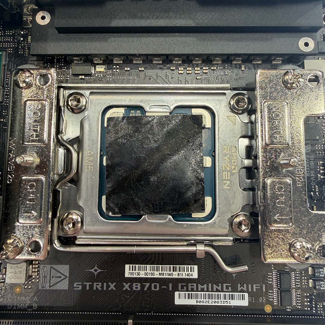 A top-down view of the NT-CP1 carbon nanotube thermal pad applied to an AM5 CPU.