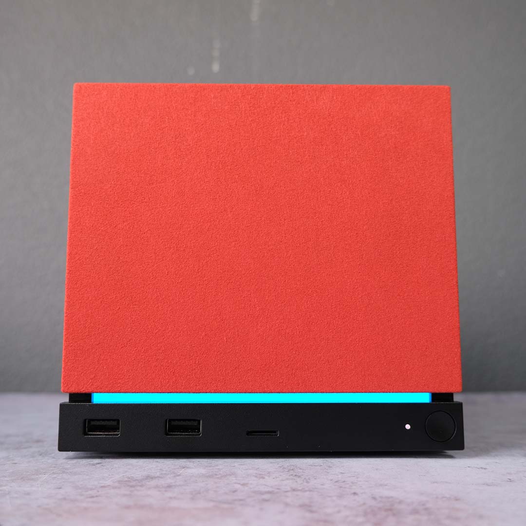 The Steam Machine with the optional red fabric faceplate attached.