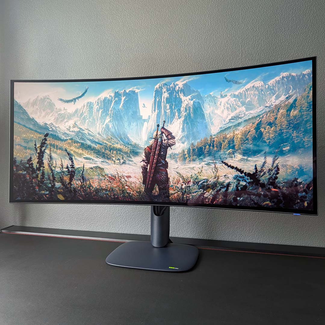 The AW3926QW displaying Witcher 3 artwork.