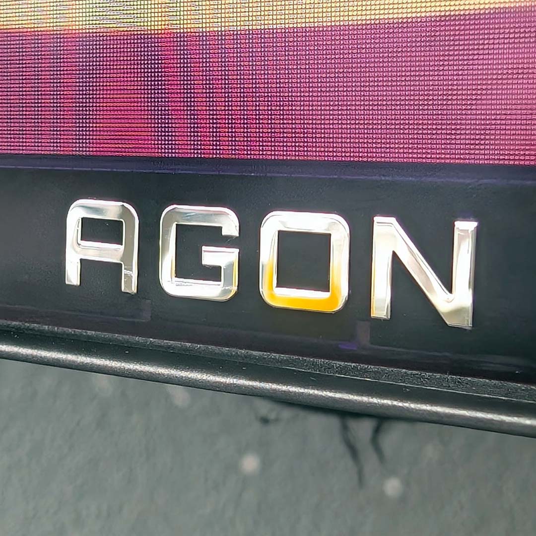 A close-up of the Agon logo on the AOC Agon Pro AGP277QKDC.