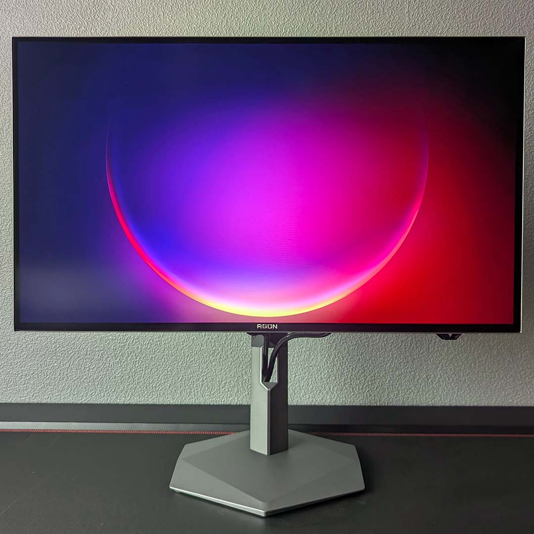 Windows 11 wallpaper displayed on the AOC Agon Pro AGP277QKDC.